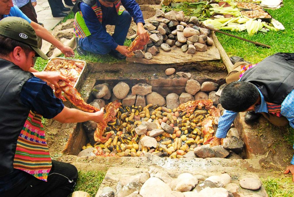Pachamanca Peru traditional dish cooking underground with hot stones