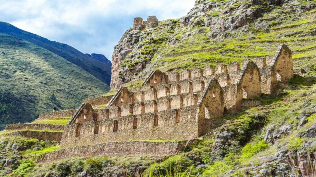 Ancient Inca storehouses of Pinkuylluna on the mountainside of Ollantaytambo in the Sacred Valley Peru.