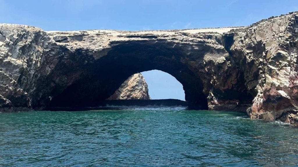 Natural sea cave rock arch in the Paracas National Reserve and Ballestas Islands on a Peru coastal tour