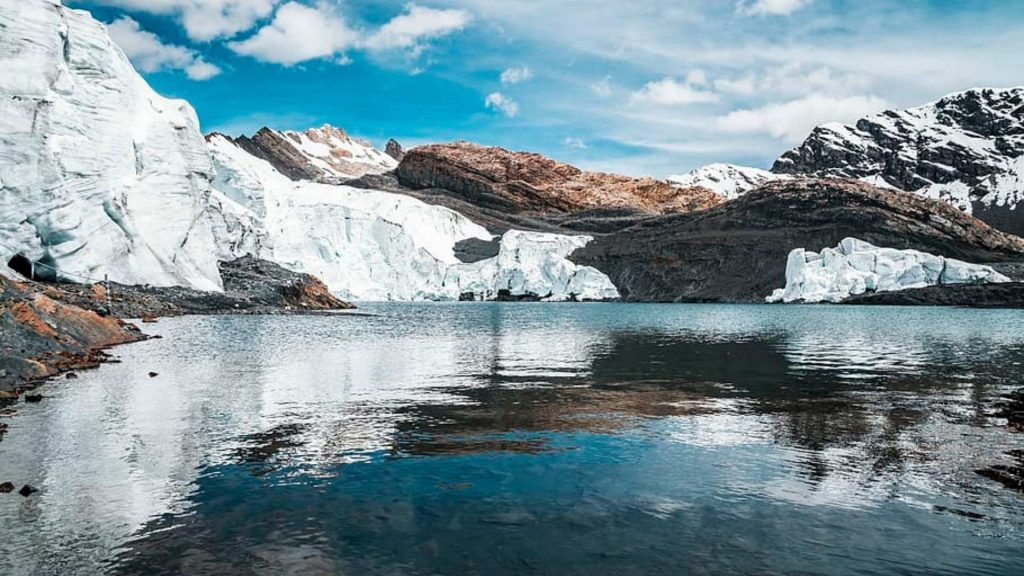 Glacial lake and ice wall at Pastoruri Glacier in the high-altitude Andes Mountains of Peru